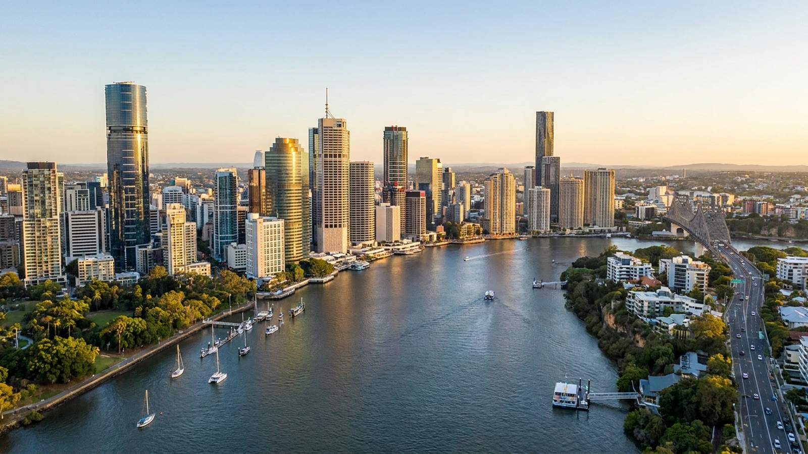 Brisbane city skyline at sunset over the river