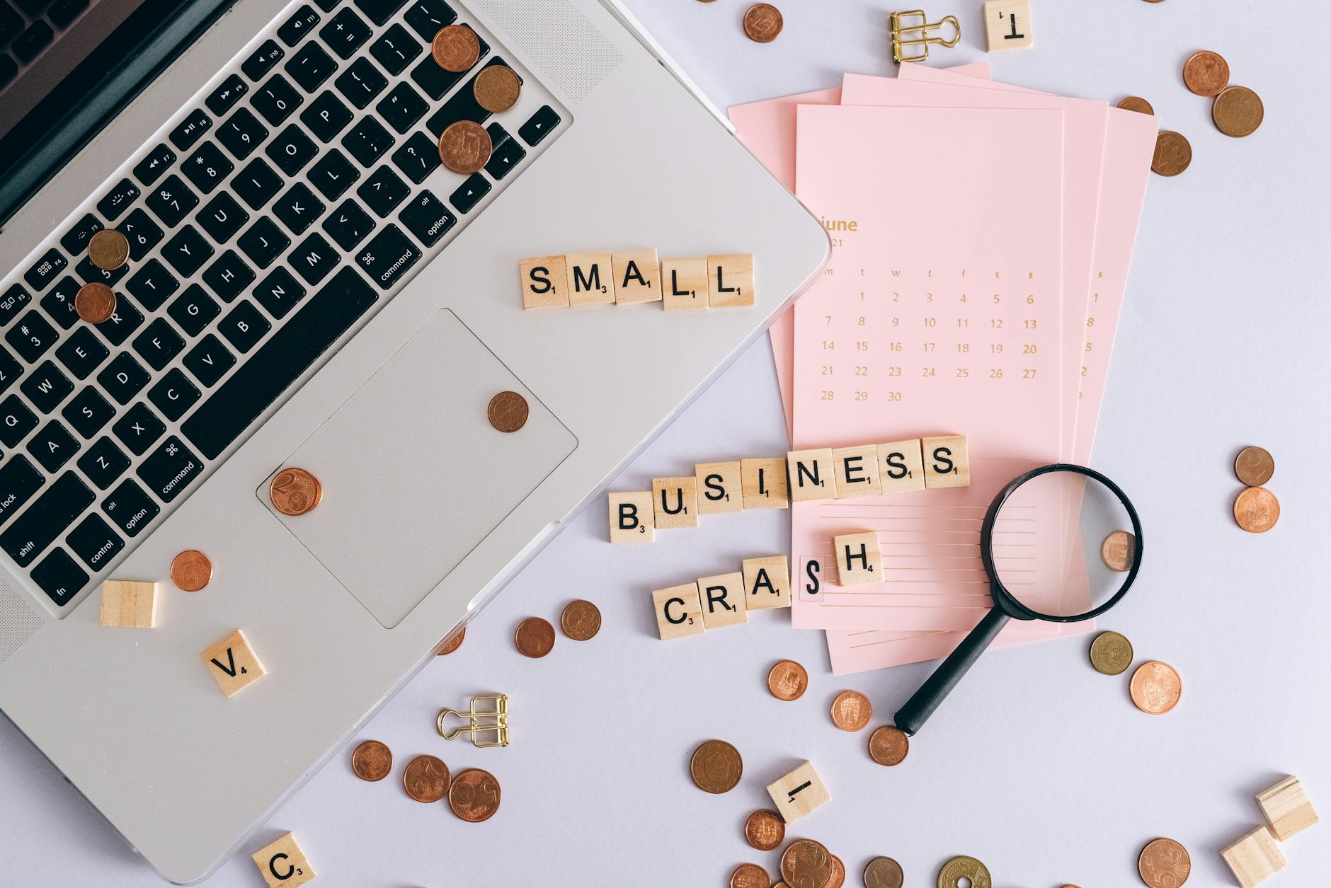 Small business owner analysing Google Ads versus Meta Ads cost comparison on laptop with financial metrics