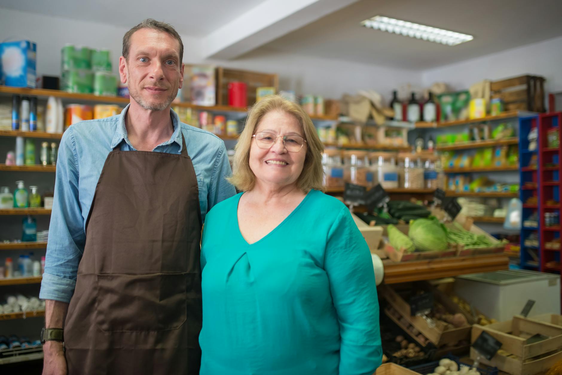 Community business owners engaging with local customers in their organic store showcasing local SEO success