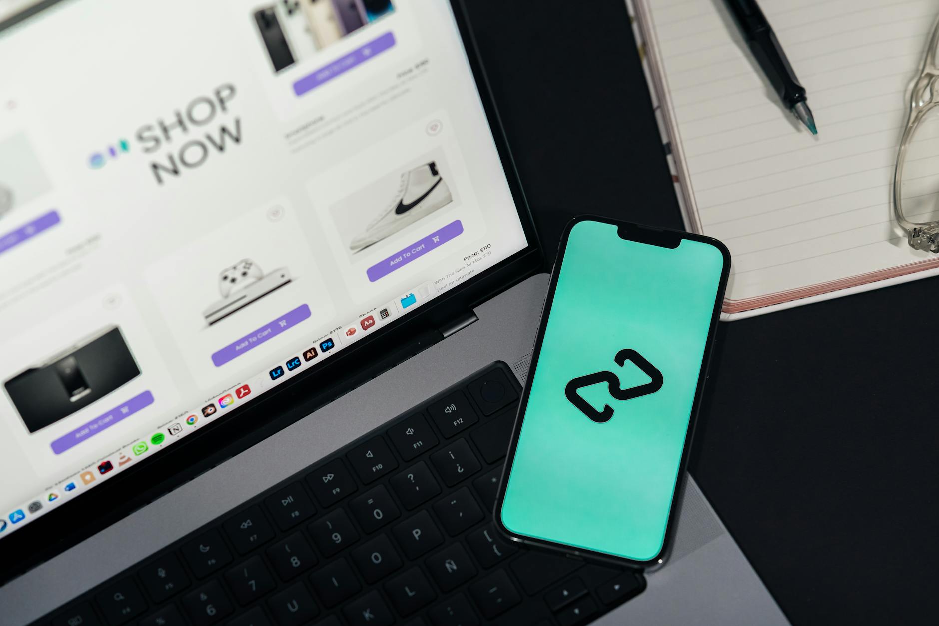 Smartphone and laptop showing ecommerce platforms illustrating website performance impact on Australian small business sales
